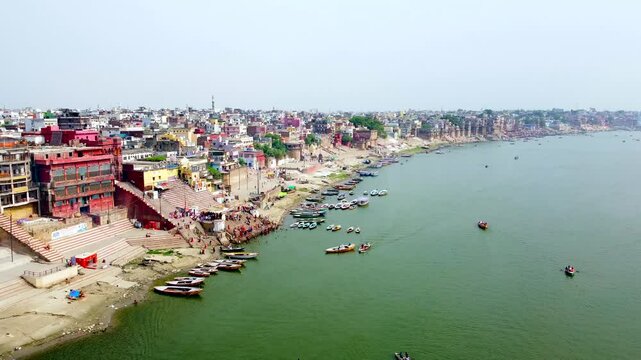  Aerial view of varanasi or banaras city and ancient architecture on the banks of river ganges .Varanasi ghats on the banks of the sacred ganges river at sunrise in varanasi, uttar pradesh, India.