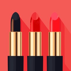 Elegant Lipsticks in Bold Colors with Gold Cases against Coral Background