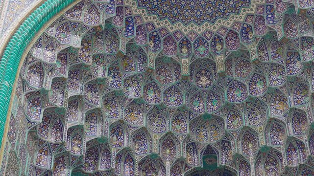 Ceiling at Imam Mosque, arch at the entrance, Naghsh-e Jahan Square, Isfahan, Iran. Beautiful oldest iranian mosque interior design. Unique mosaics and ornaments. A masterpiece of Persian architecture