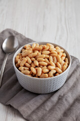 Canned White Cannellini Beans in a Bowl, side view.