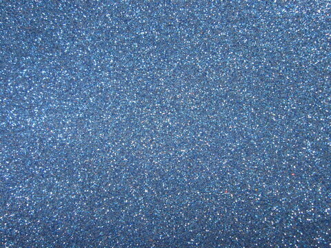 The shimmering blue glitter creates a captivating backdrop perfect for a variety of creative projects. It enhances decorative items, adding sparkle and flair