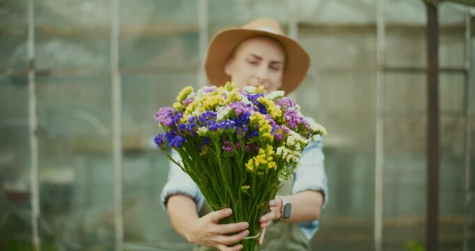 Gardener Holds Bouquet of Dandelion in Hands
