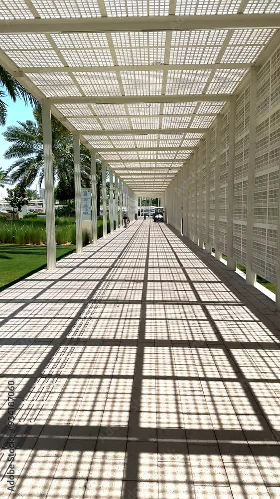 Poster contemporary walkway feat striking shadow patterns from overhead design sunlight filtering through c