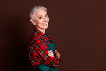 Photo of lovely optimistic attractive lady wear red checkered shirt work in agriculture isolated on brown color background