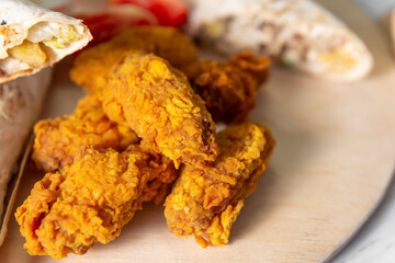 fried chicken legs and wings close up 
