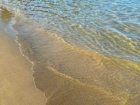 Calm sea on sandy beach at summer