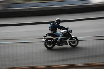 Fototapeta premium Photo of a motorbike driving through the city 