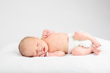 Newborn baby boy in hospital cot