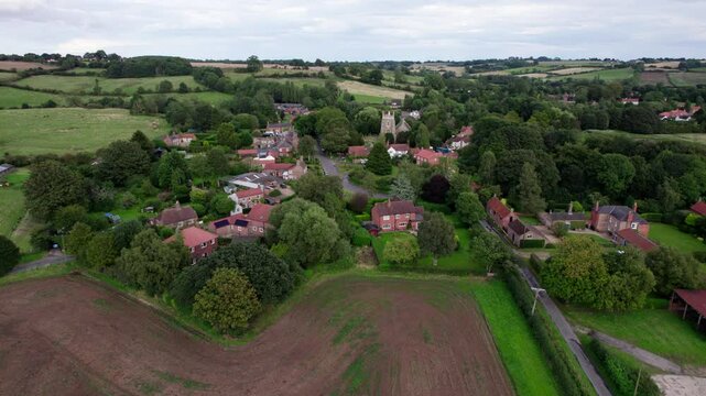 Aerial video footage of the remains of Bolingbroke Castle a 13th century hexagonal castle, birthplace of the future King Henry IV, with adjacent earthwork. and views of Old Bolinbroke Village.