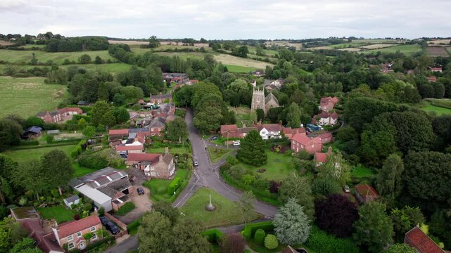 Aerial video footage of the remains of Bolingbroke Castle a 13th century hexagonal castle, birthplace of the future King Henry IV, with adjacent earthwork. and views of Old Bolinbroke Village.