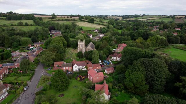 Aerial video footage of the remains of Bolingbroke Castle a 13th century hexagonal castle, birthplace of the future King Henry IV, with adjacent earthwork. and views of Old Bolinbroke Village.