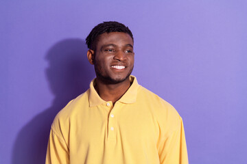 Fototapeta premium Photo portrait of handsome young guy look empty space dressed stylish yellow garment isolated on violet color background