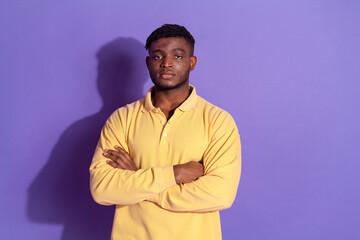 Photo portrait of attractive young man crossed hands strict face dressed stylish yellow clothes...