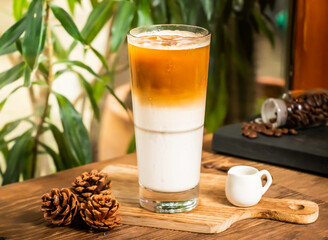 Iced Latte served in glass isolated on table side view of taiwan drink