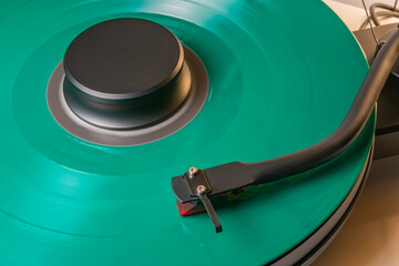 Coloured vinyl record spinning on a hifi turntable
