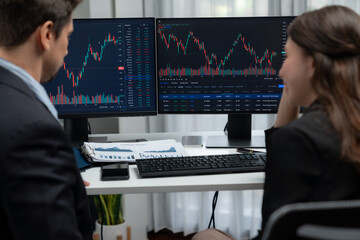Successful in two business traders making hands high five with fist up to earn highest profit stock...