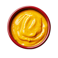 Smooth golden mustard sauce in a vivid red bowl top view isolated on transparent background 