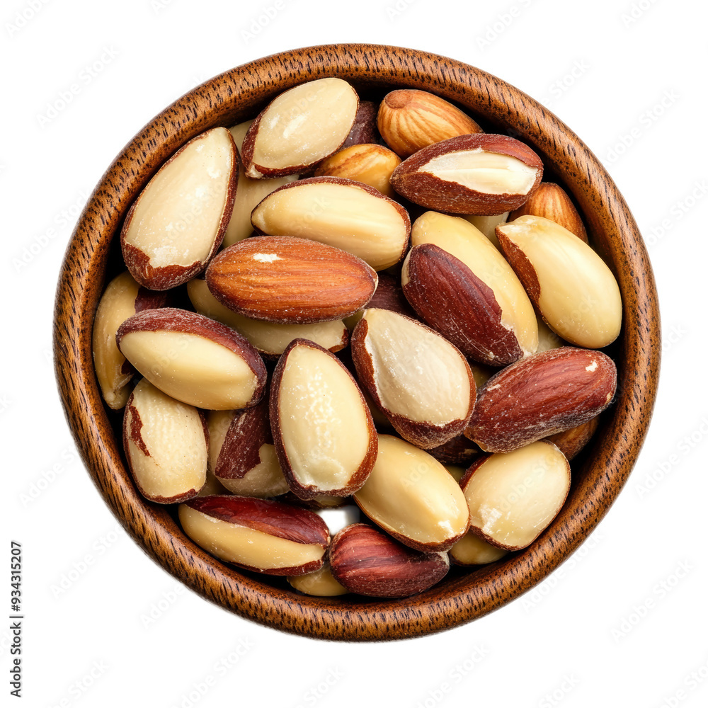 Wall mural Top view shelled Brazil nuts packed in wooden bowl isolated on transparent background 