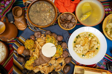 traditional bolivian food with meat and cheese on cloth called aguayo - traditional food concept