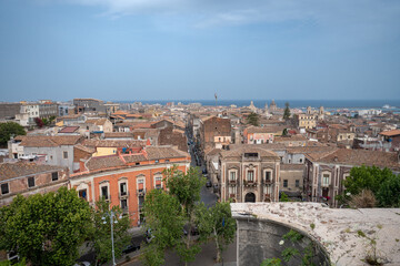 Naklejka premium Catania, Italy - May 18, 2024: Cityscape view from the observation deck on top of San Nicolo l'Arena church.