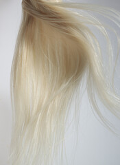 blond hair extension flying 