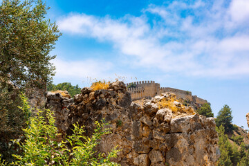 Landscape view old walls of fortress on Mediterranean coast. View of Alanya Castle, stone ruins in Alanya, Turkey. High quality photo