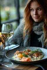 Elegant dining with grilled fish and seasonal vegetables at a restaurant in the evening