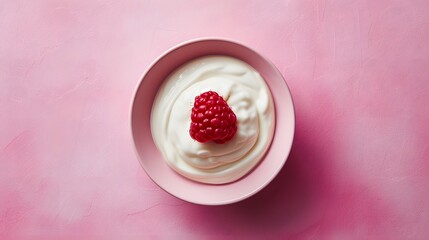 A raspberry placed in the center of a plain yogurt scoop in a flat bowl atop a minimal tabletop AI generated illustration