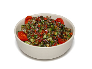 Healthy mixed salad in white bowl on wooden table. Mediterranean salad