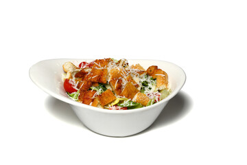 Healthy mixed salad in white bowl on wooden table. Mediterranean salad