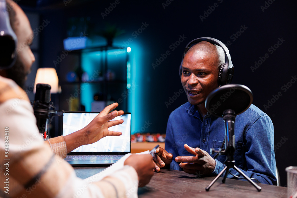 Poster black man radio show host holds live chat with guest and records the interaction for audience to hea