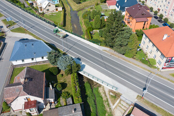 Reinforced concrete road bridge over the river. Close-up during sunny day in summer. Aerial view on...