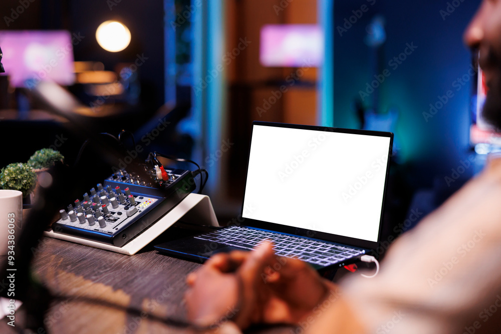 Poster electronic device near microphone audio mixer is displaying an isolated white screen. digital laptop