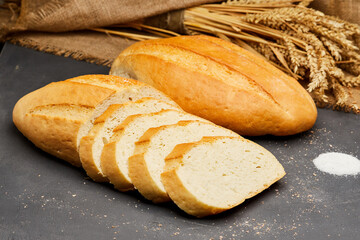 Golden, freshly sliced loaf of homemade bread, perfect for sandwiches, breakfast, or toasting