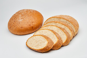 Whole wheat bread loaf sliced, showcasing its hearty texture and rich, wholesome flavor