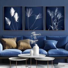 Collection of three framed canvases with abstract white plants a deep blue backdrop