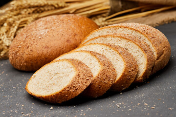 Whole wheat bread loaf sliced, showcasing its hearty texture and rich, wholesome flavor
