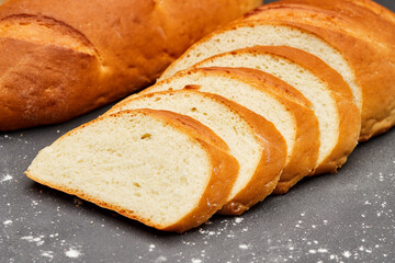 Golden, freshly sliced loaf of homemade bread, perfect for sandwiches, breakfast, or toasting