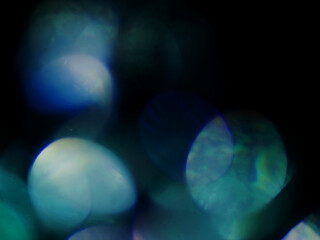 Light leaks on dark background. The colors and shapes create a sense of movement and energy....