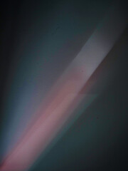 Abstract color shapes on dark background with small texture. Light rays. Elements for design.