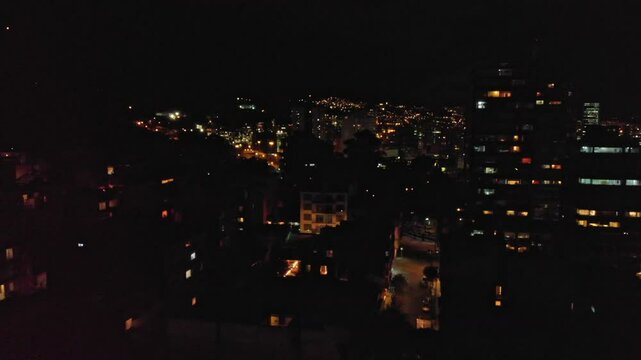 Aerial view of streets and buildings of Macarena, Bogota Colombia at Night 2
