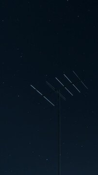 Professional vertical time lapse, tv antenna and night sky, no flicker