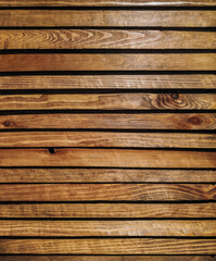 Fototapeta premium Texture of old burnt brown wood close-up. Natural background. Copy space. Vertical.