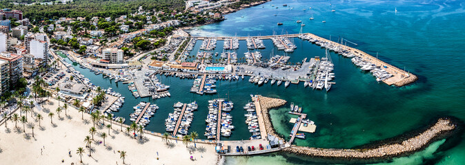S'Arenal, Spain, aerial view of S'Arenal harbour on the coastline, located at Bay of Palma in the south-west of the Balearic Island of Mallorca with many boots moored  © Mario Hagen