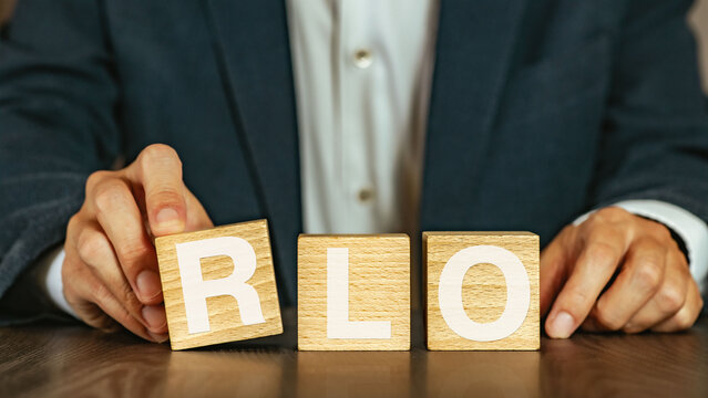 There is wood cube with the word RLO. It is an abbreviation for Recovery Level Objective as eye-catching image.