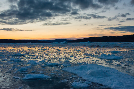 Greenland. Disko Bay. Brash ice at sunset.