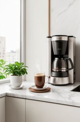 A coffee maker sits on a counter next to a cup of coffee
