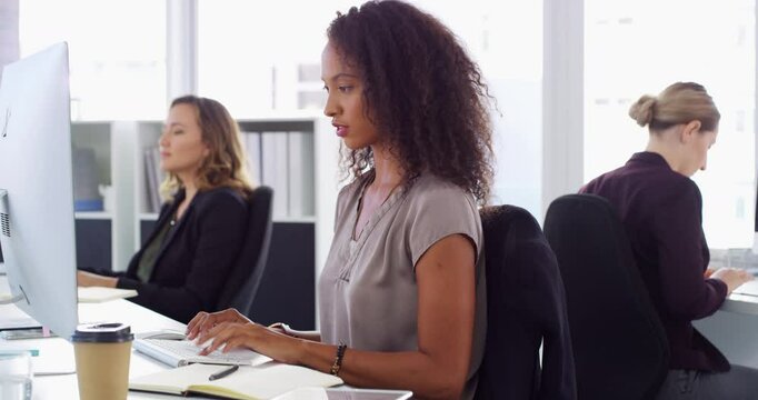 Woman, working and office with computer, typing and happy for job, employee and consultant. Smile, online and confident for growth strategy, technology and positive for project research and workplace