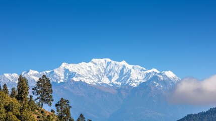 Majestic mountain range with snow-capped peaks and clear blue sky above. Majestic Mountain Range