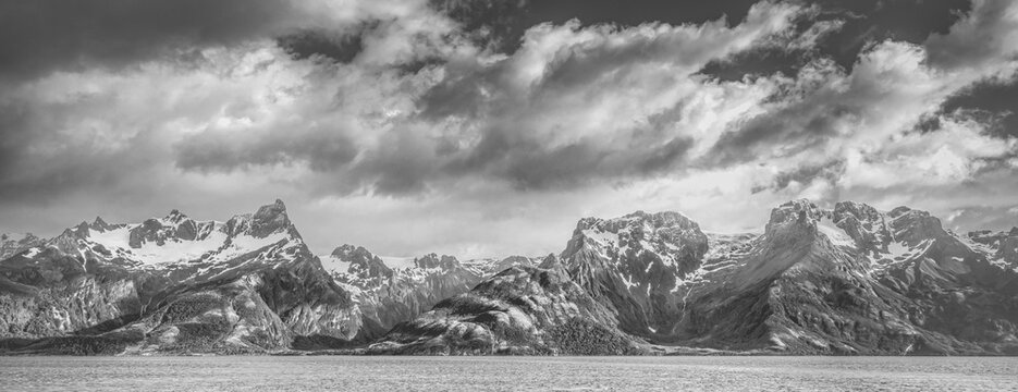 Argentina, Tierra del Fuego National Park. Black and white panoramic of Magellan Strait and mountain range.